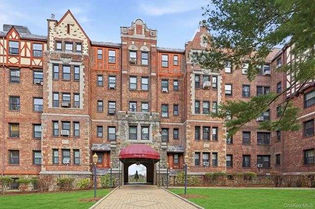 a front view of a building with garden