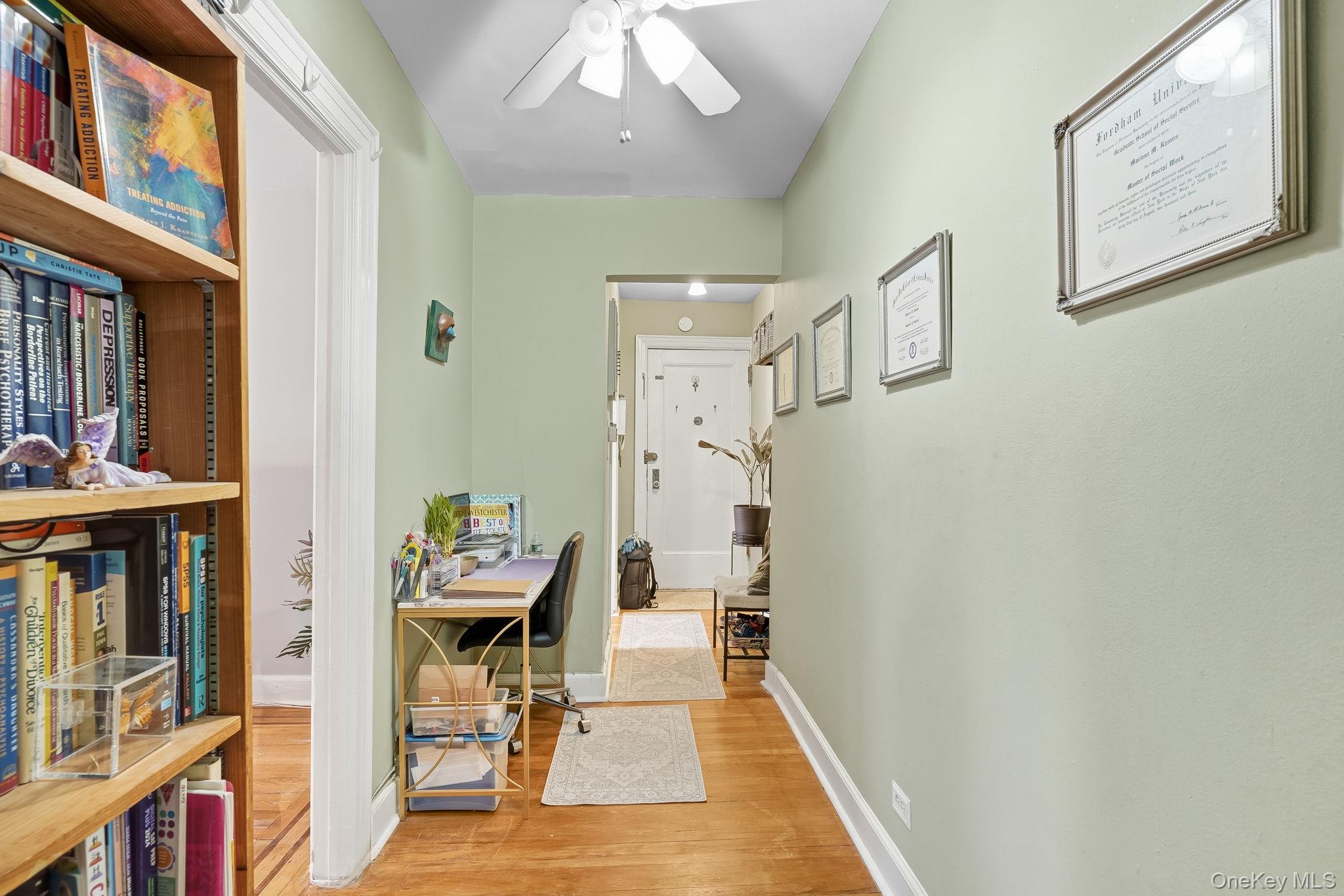 23 Old Mamaroneck Road, Unit 3L White Plains, NY 10605 - Photo 13 of 16 Hallway with light wood-type flooring and a desk