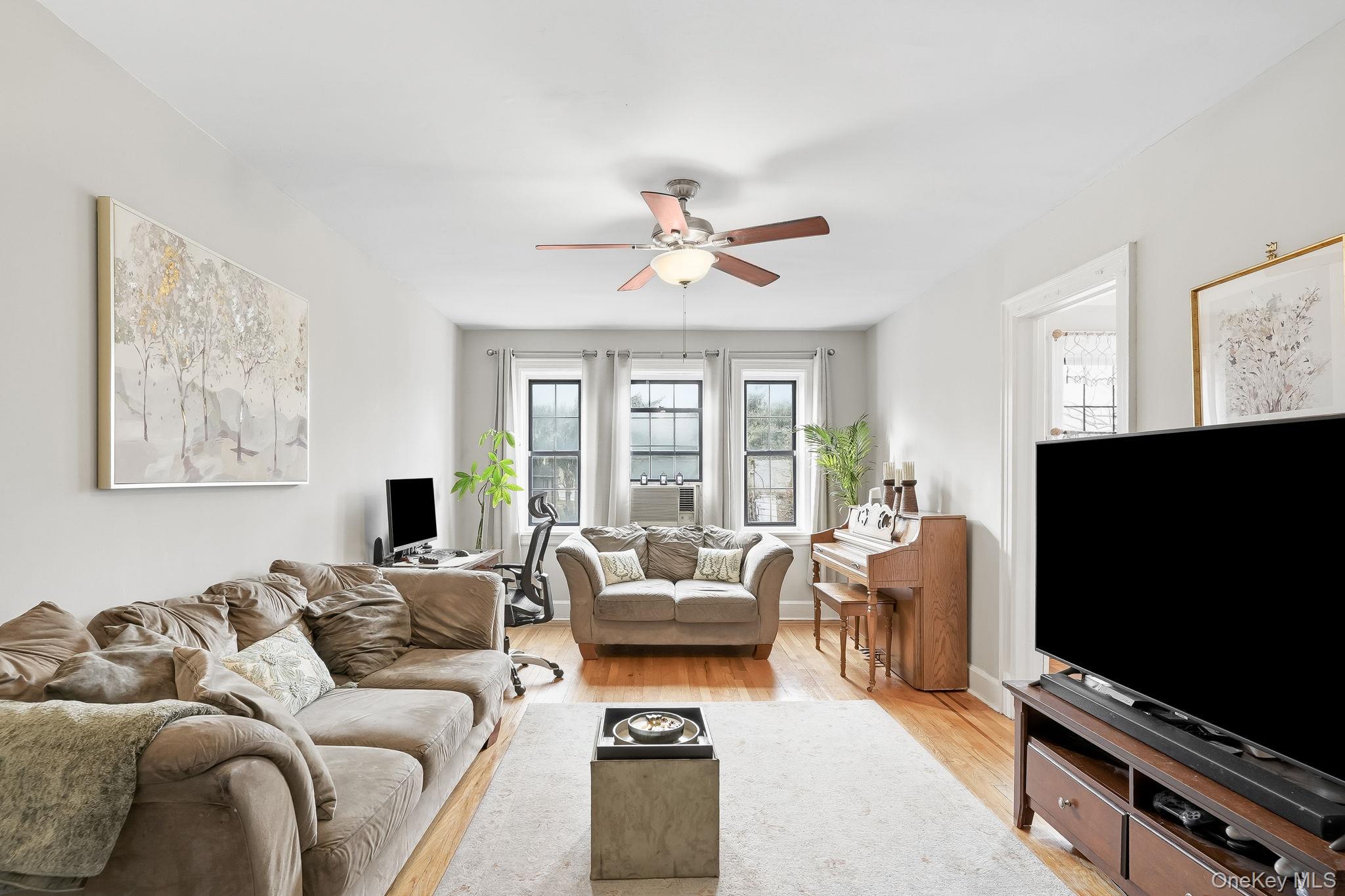 23 Old Mamaroneck Road, Unit 3L White Plains, NY 10605 - Photo 3 of 16 Living area featuring light wood-type flooring and ceiling fan