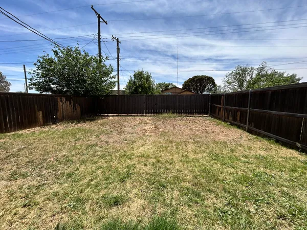 a swimming pool with wooden fence