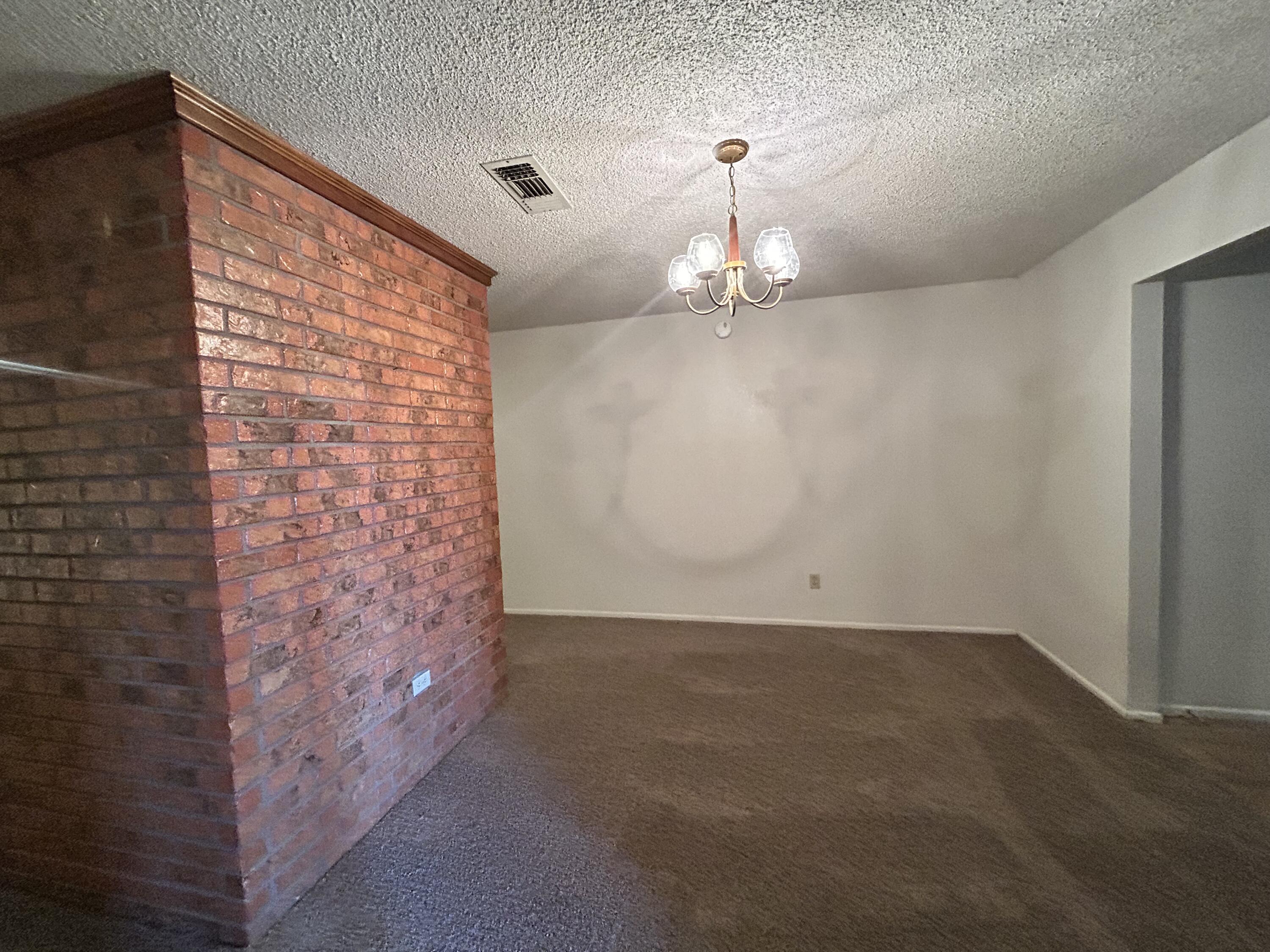 1115 80th Street, Unit A Lubbock, TX 79423 - Photo 7 of 16 a view of empty room with stairs
