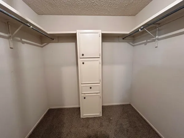 a view of an empty walk in closet