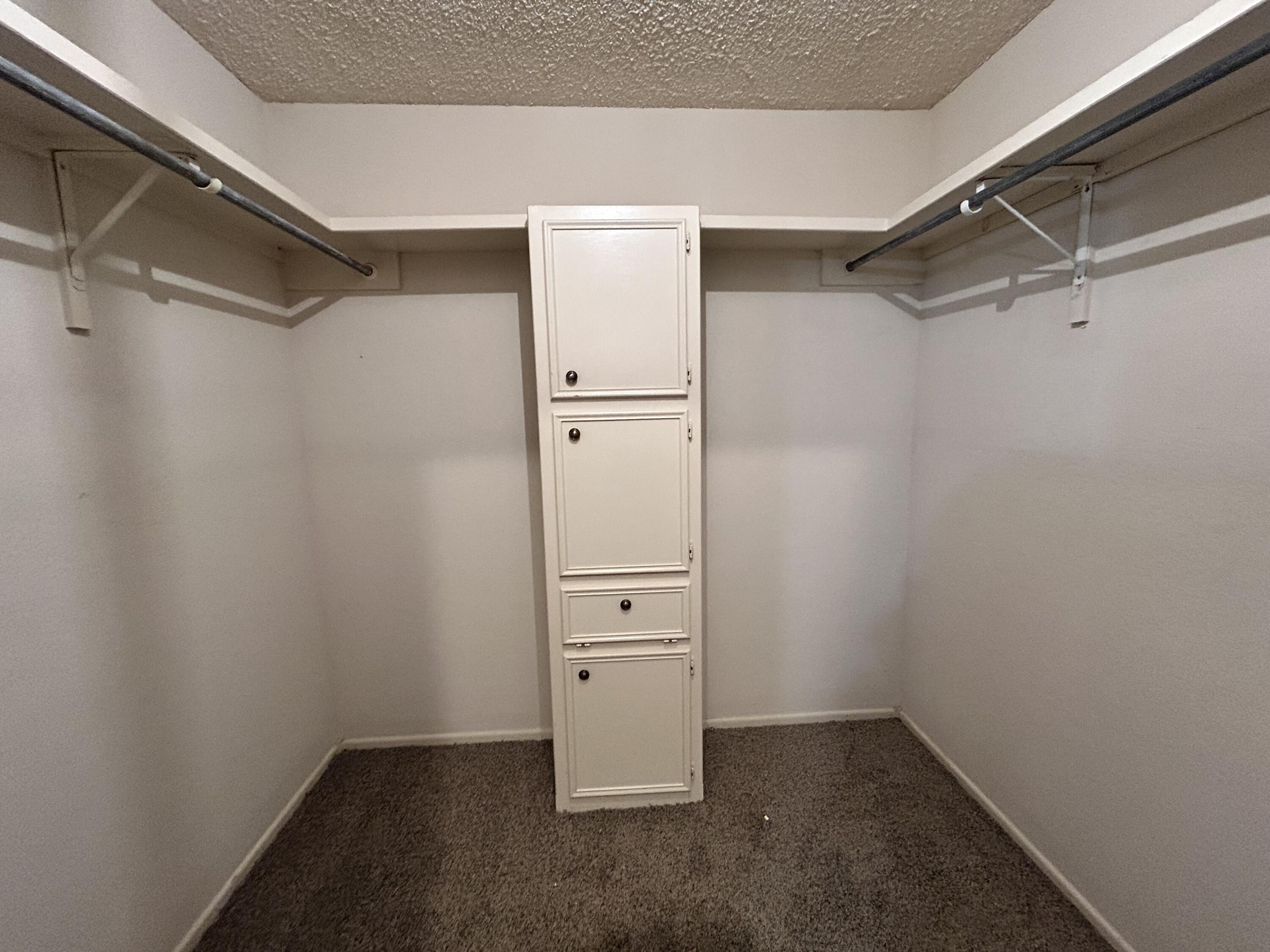 1115 80th Street, Unit A Lubbock, TX 79423 - Photo 9 of 16 a view of an empty walk in closet