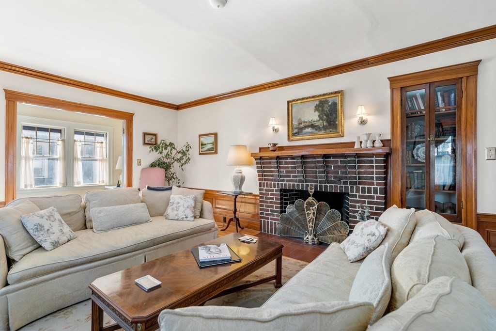18 Fairfax Road Milton, MA 02186 - Photo 14 of 30 a living room with furniture and a fireplace