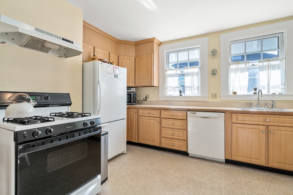 18 Fairfax Road Milton, MA 02186 - Photo 19 of 30 a kitchen with stainless steel appliances a stove a sink and a refrigerator