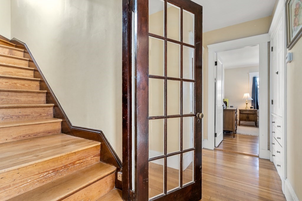 18 Fairfax Road Milton, MA 02186 - Photo 20 of 30 a view of a hallway with wooden floor and staircase