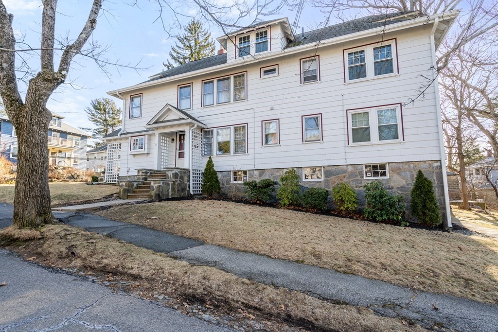 18 Fairfax Road Milton, MA 02186 - Photo 2 of 30 a front view of a house with a yard and a garage