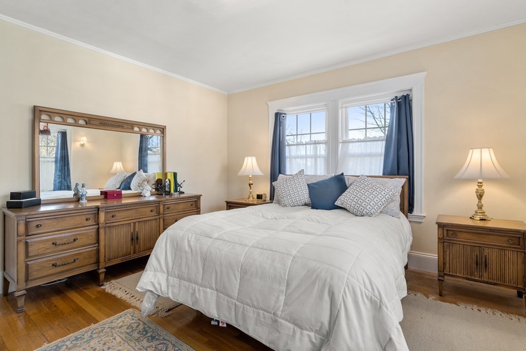 18 Fairfax Road Milton, MA 02186 - Photo 23 of 30 a bedroom with a bed and a mirror on dresser