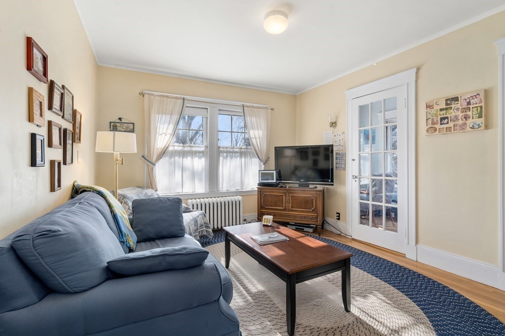 18 Fairfax Road Milton, MA 02186 - Photo 24 of 30 a living room with furniture a flat screen tv and a window