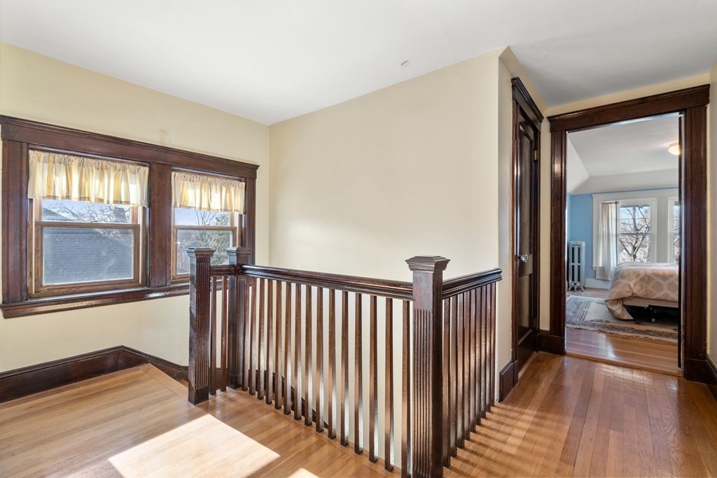 18 Fairfax Road Milton, MA 02186 - Photo 26 of 30 a view of a hallway with wooden floor and windows