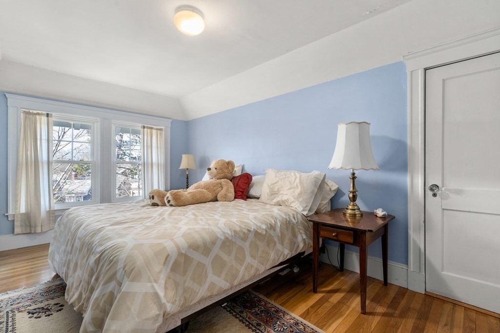 18 Fairfax Road Milton, MA 02186 - Photo 27 of 30 a bedroom with a bed and a large window