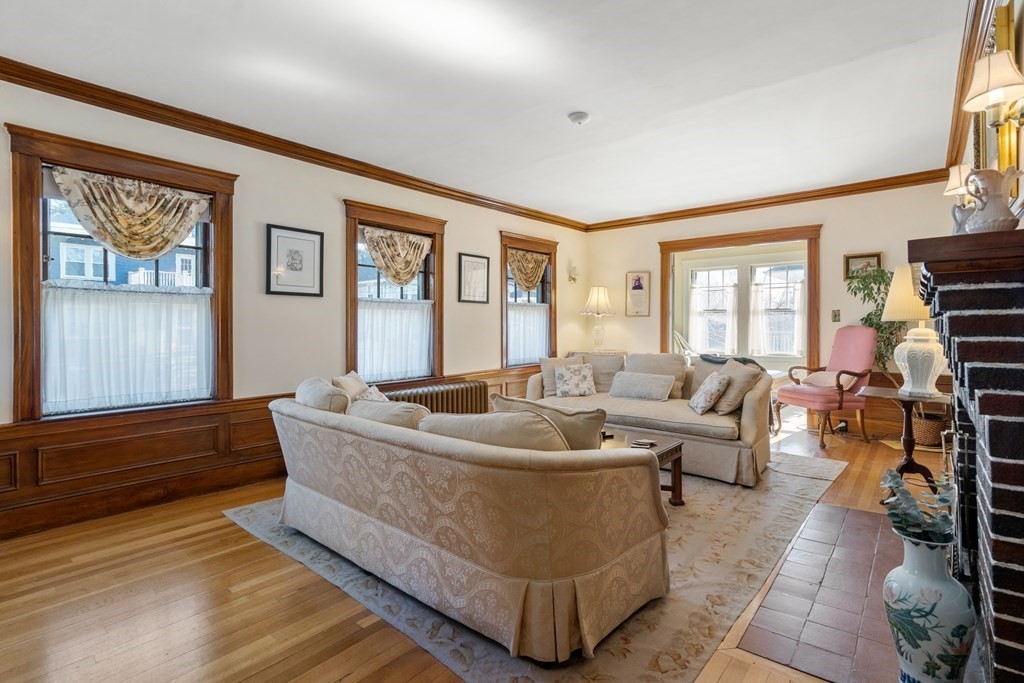 18 Fairfax Road Milton, MA 02186 - Photo 8 of 30 a living room with furniture and a flat screen tv