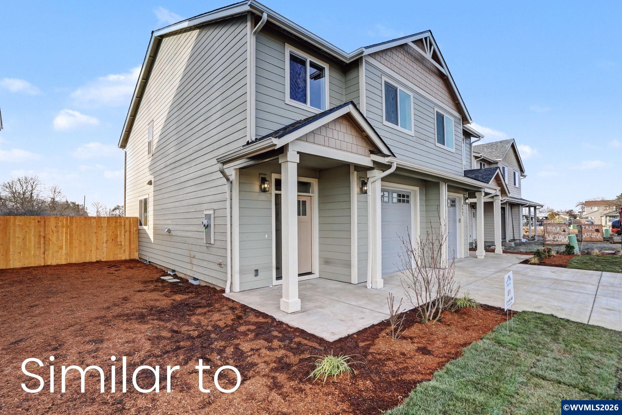 2550 Promise Way Lebanon, OR 97355 - Photo 2 of 35 a front view of a house with a yard