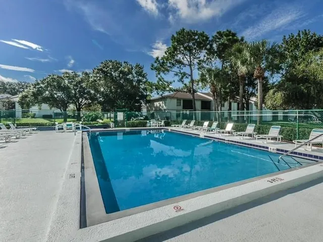swimming pool view with a outdoor seating