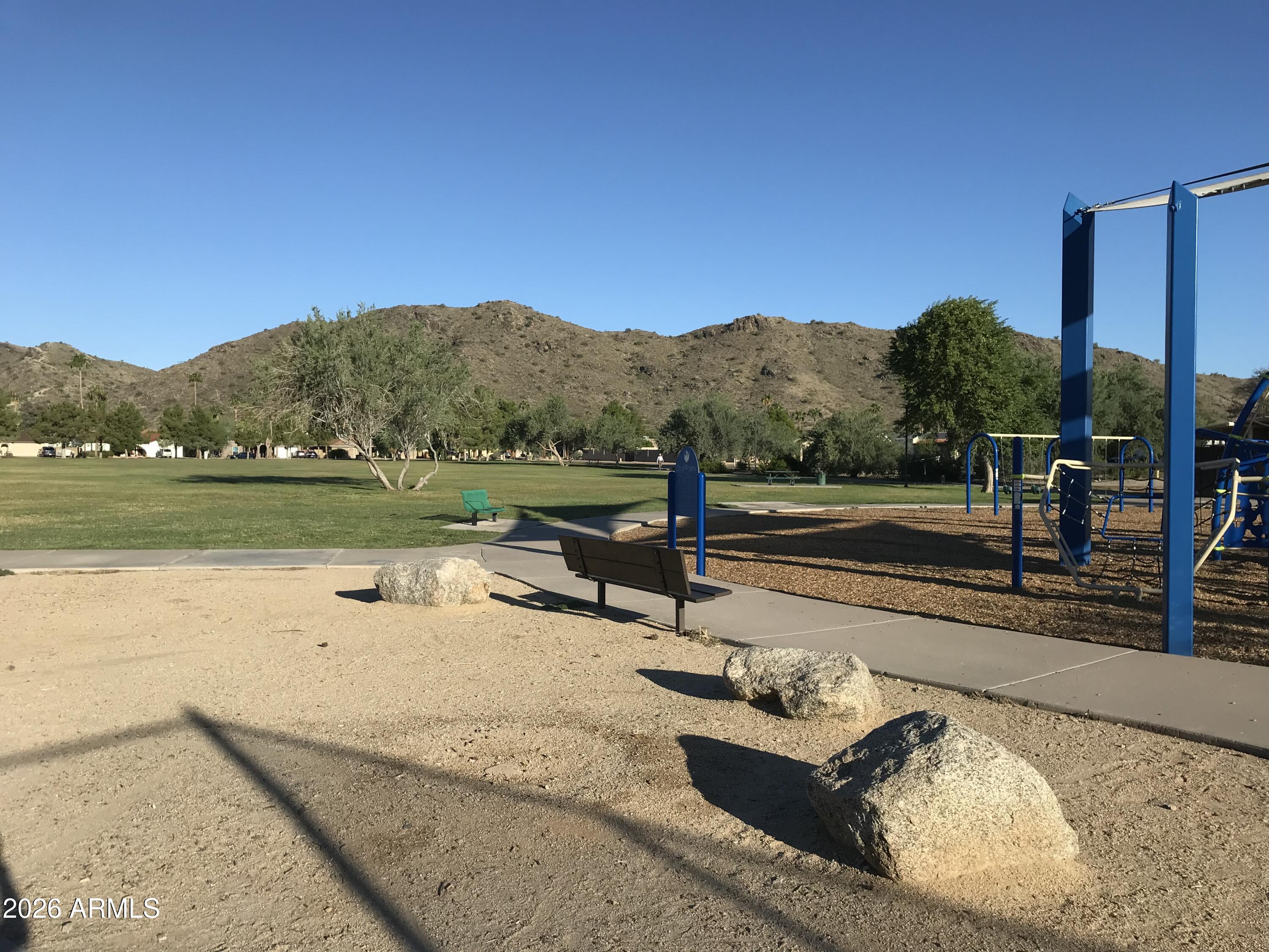 10610 South 48th Street, Unit 1061 Phoenix, AZ 85044 - Photo 4 of 6 a view of a lake with a mountain