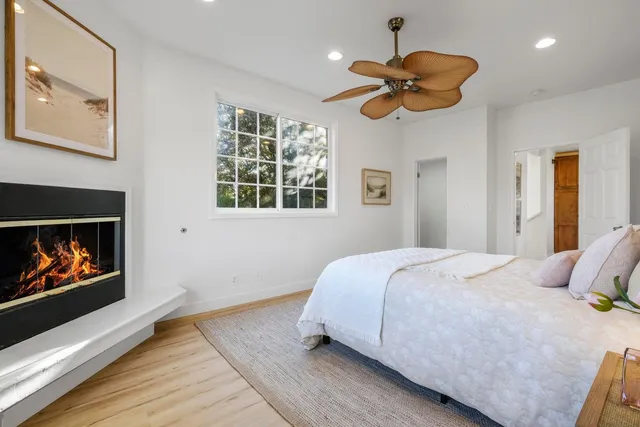 a bedroom with bed and a chandelier
