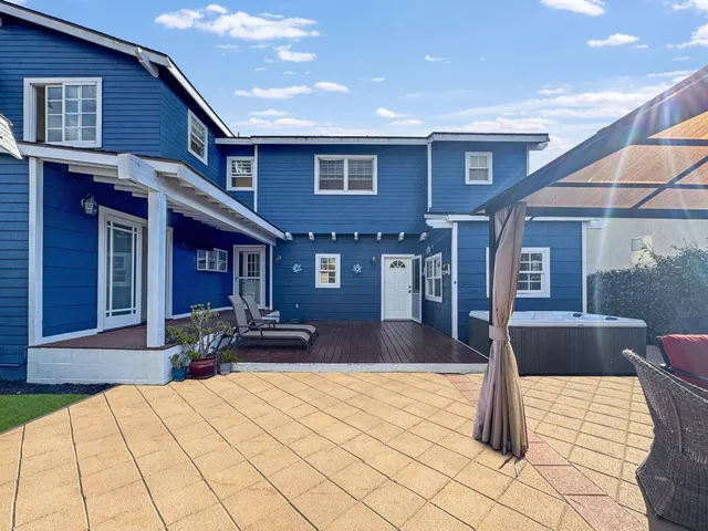 a front view of a house with a patio