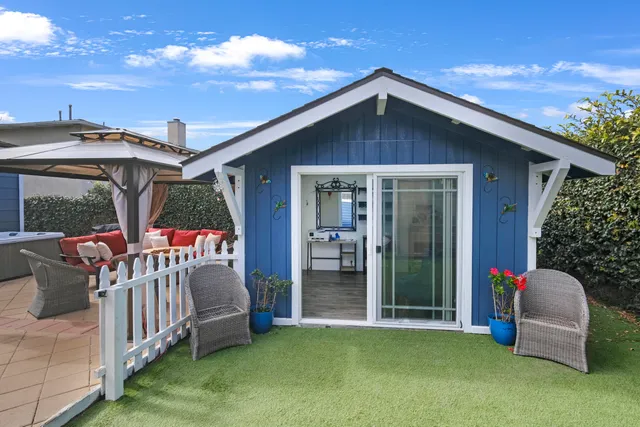 a view of a house with porch and furniture