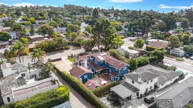 an aerial view of residential houses with outdoor space