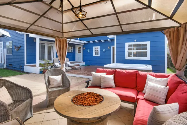 a outdoor living space with furniture and a rug