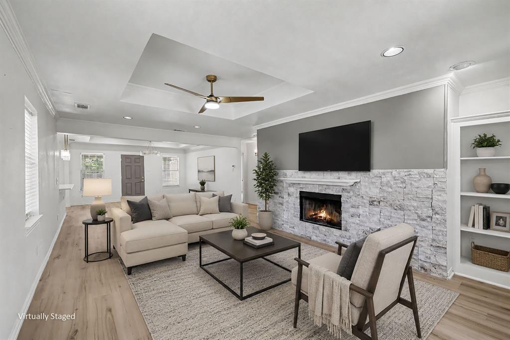 307 Dixon Street Terrell, TX 75160 - Photo 7 of 32 Living area featuring wood-finish flooring, a tray ceiling with a modern ceiling fan, and recessed lighting