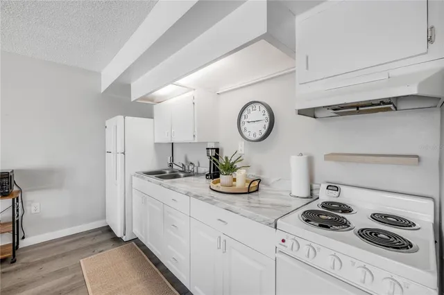 a view of hallway with wooden floor