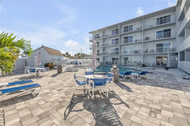 a view of a swimming pool with a lounge chairs