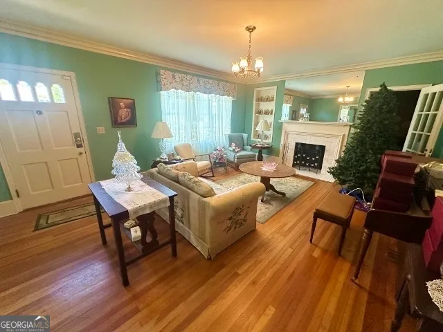 a living room with furniture dining table and a fireplace