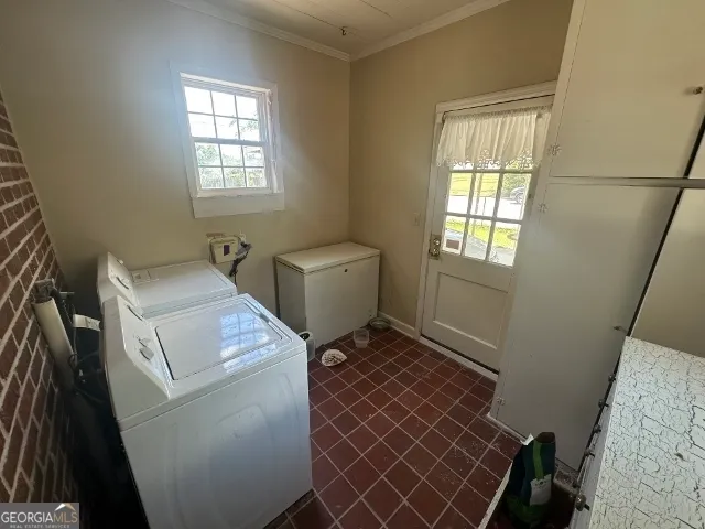 a utility room with dryer and washer