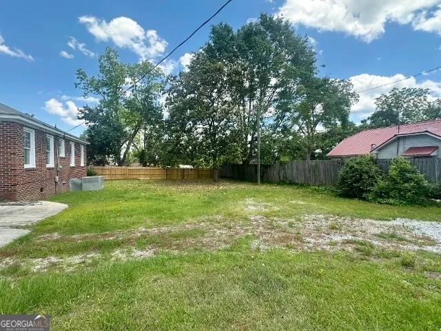 a backyard of a house with lots of green space