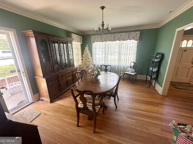 a view of a livingroom with furniture window and wooden floor
