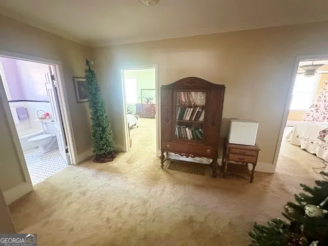 a view of a hallway with seating area