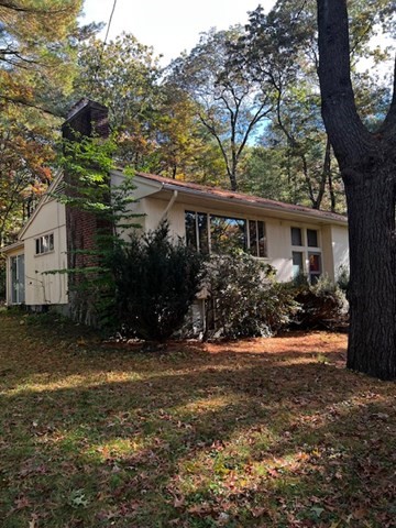 17 Suffolk Road Wellesley, MA 02481 - Photo 5 of 6 a view of a house with a yard