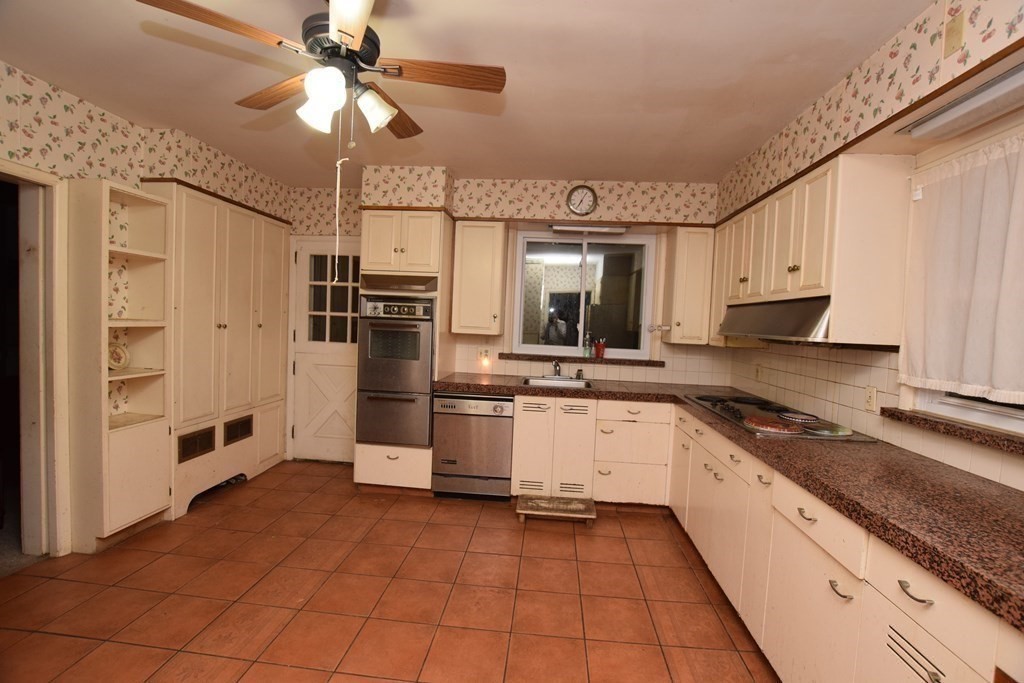 230 Oakley Road Woonsocket, RI 02895 - Photo 6 of 20 a large kitchen with cabinets and stainless steel appliances