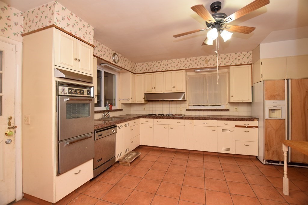 230 Oakley Road Woonsocket, RI 02895 - Photo 7 of 20 a kitchen with a refrigerator a sink and dishwasher