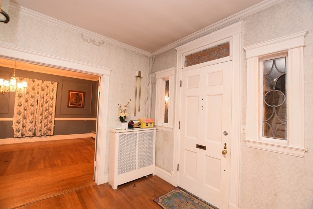 230 Oakley Road Woonsocket, RI 02895 - Photo 9 of 20 a view of a hallway with wooden floor and windows
