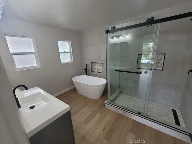 a bathroom with a toilet sink and shower