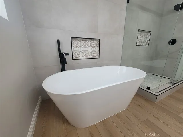 a white bath tub sitting in a bathroom