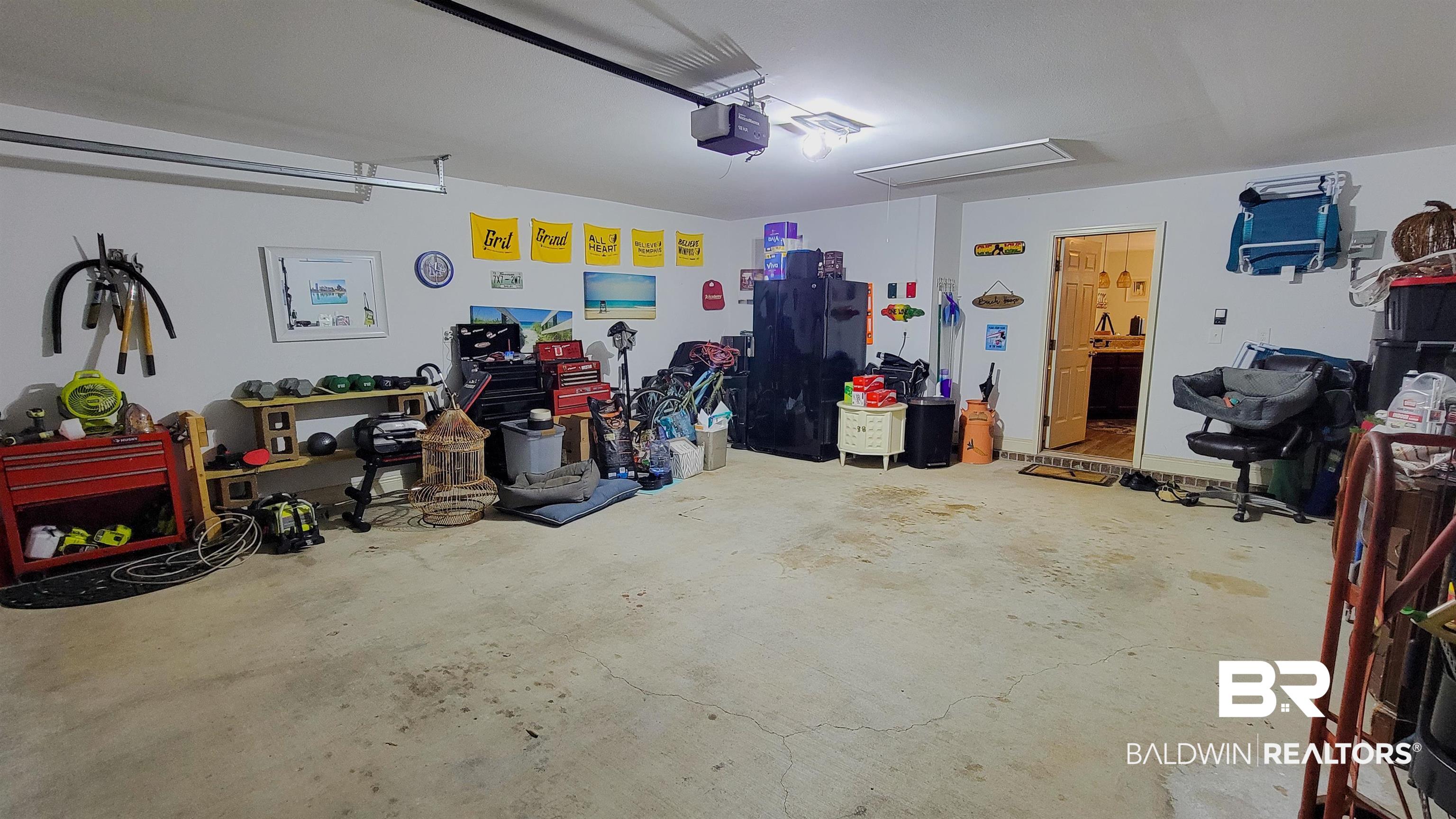 1304 Majesty Loop Foley, AL 36535 - Photo 23 of 44 Garage featuring a garage door opener