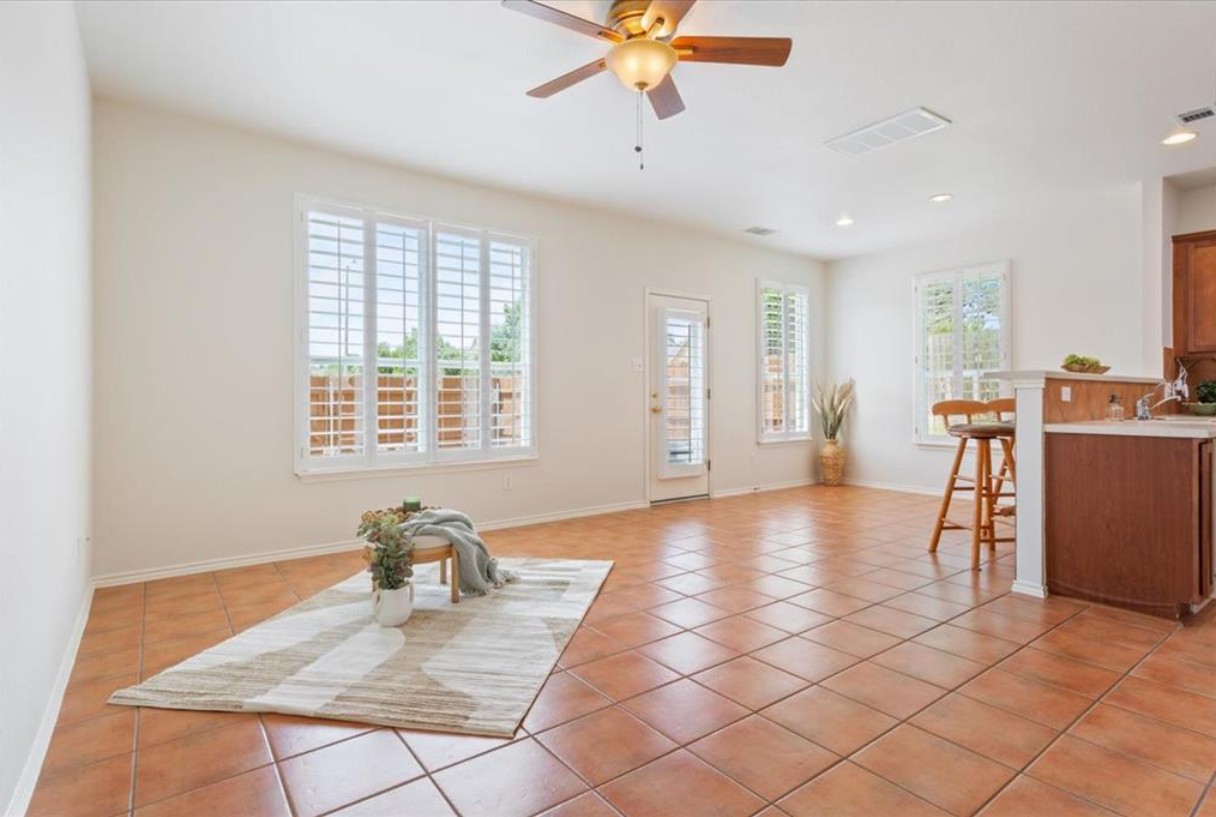 a view of a livingroom with workspace and a window