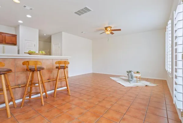 a kitchen with a stove top oven sink and cabinets
