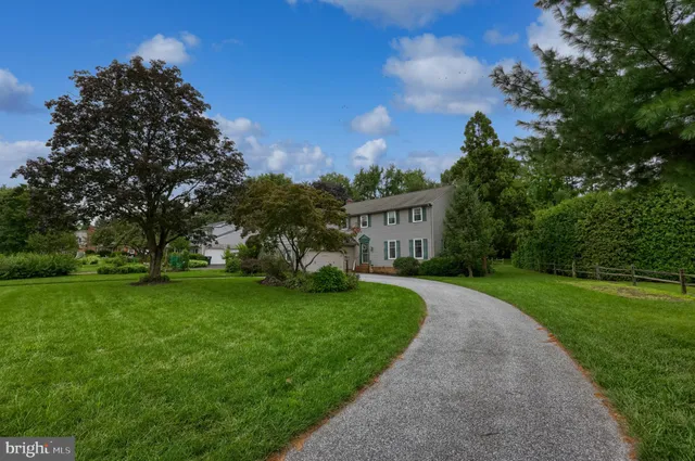 a view of a garden with a building in the background