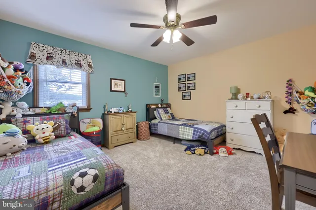 a bedroom with furniture and a chandelier