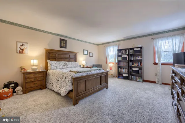 a bed room with a bed and a television