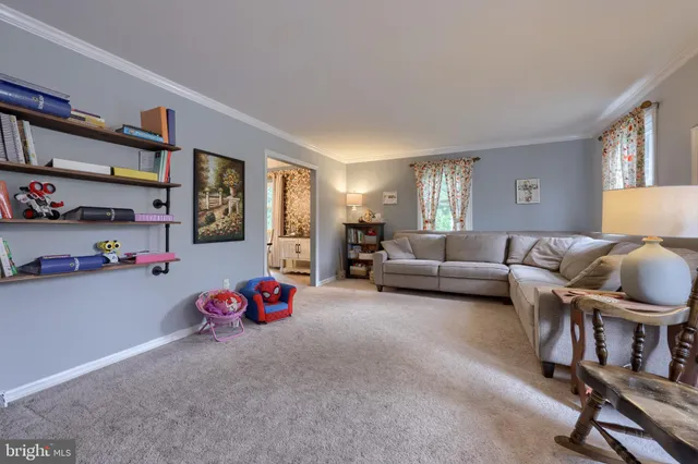 a bedroom with furniture and a book shelf
