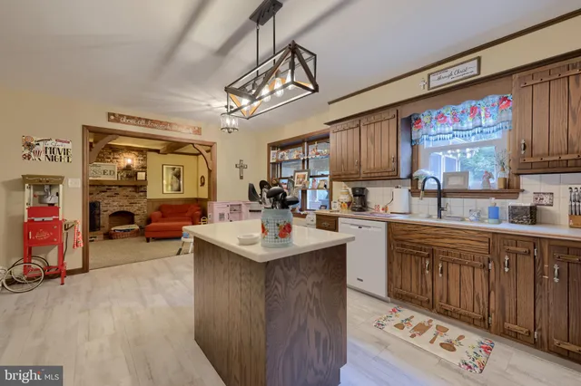 a kitchen with furniture a sink a window and appliances