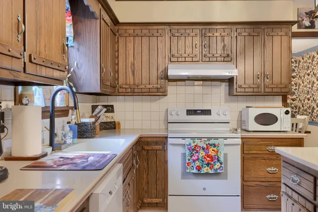 a kitchen with a cabinets and appliances