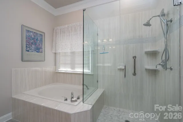 a bath tub sitting next to a shower