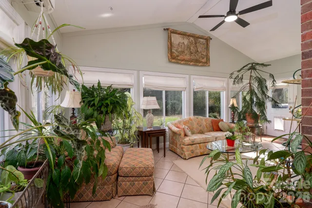 a living room with patio furniture