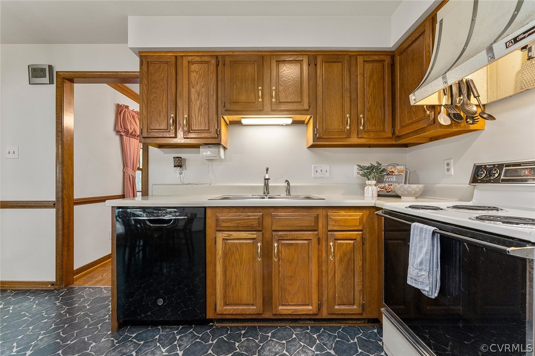 3601 Markey Road Midlothian, VA 23112 - Photo 16 of 33 a kitchen with stainless steel appliances granite countertop a stove a sink and a refrigerator